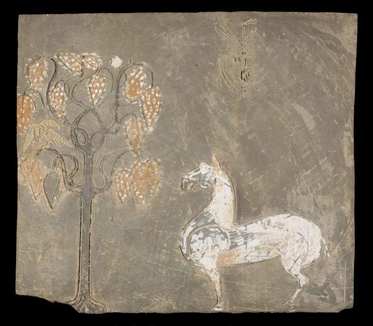 An image of TileTile from a tomb chamber. Earthenware with remains of red and white pigmentation over incised decoration of a winged horse standing by a tree with a bird perching in its branches.ChinaHan Dynasty (BC 206 - AD 220)