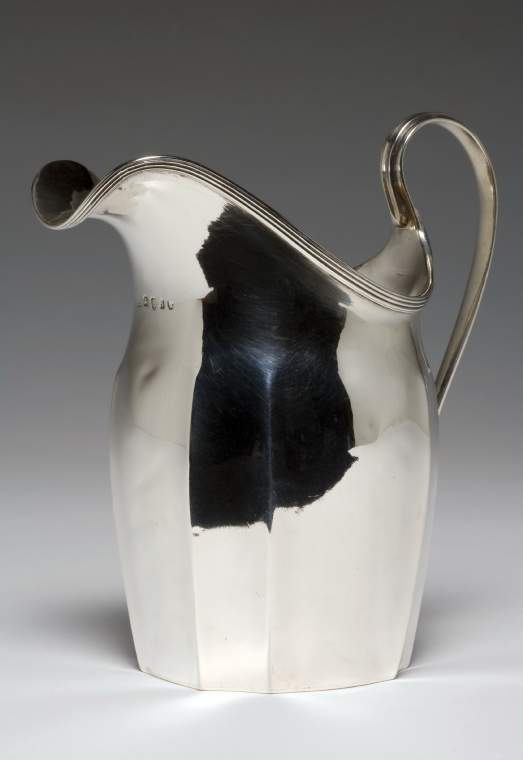 An image of TAYLOR, AbrahamSilver cream jugSilver; the helmet-shaped body has fluted sides beneath a reeded rim, and a flat bottom, and a reeded loop handleC.1796-7London, England