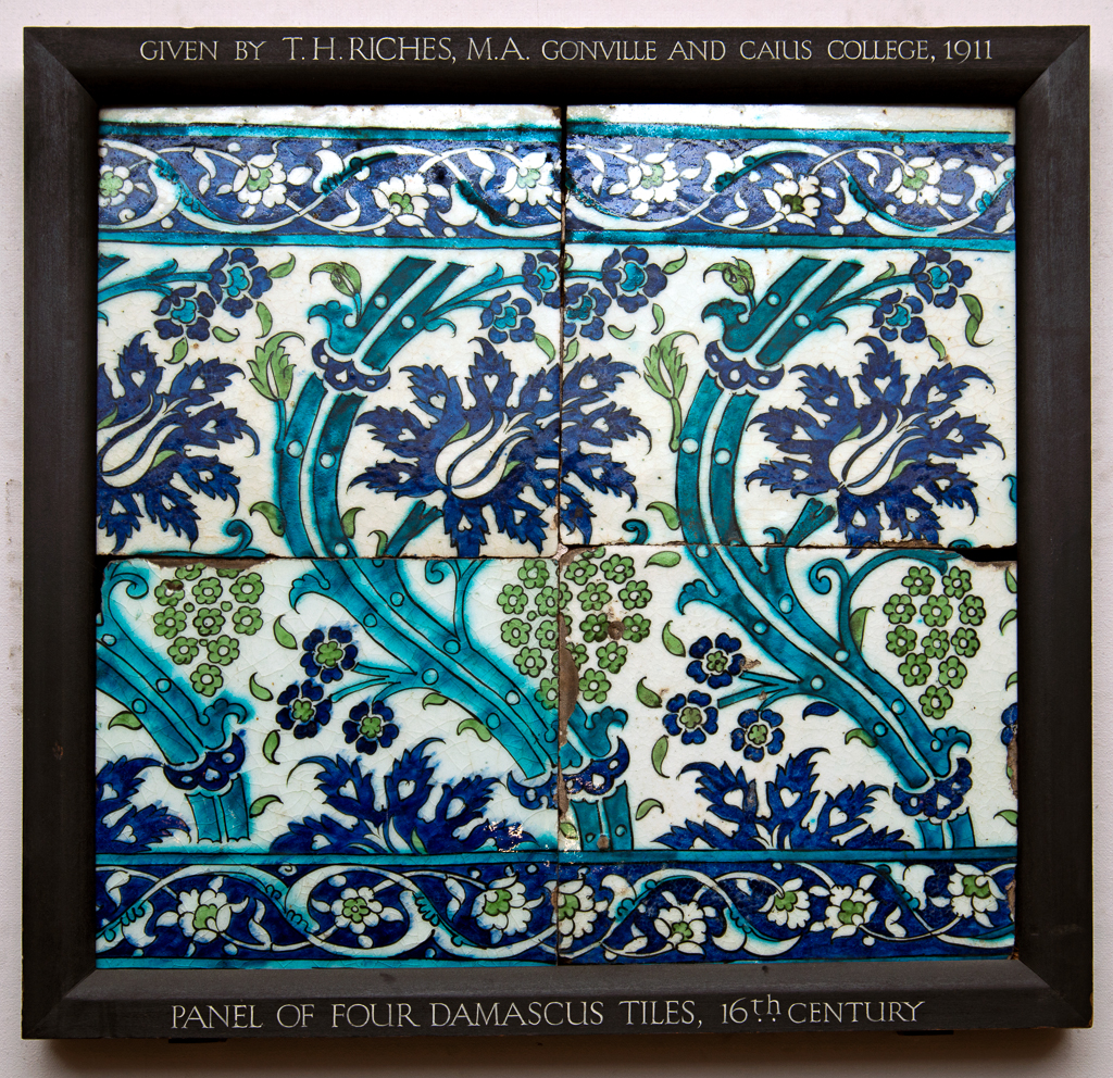 An image of Fritware (stonepaste) tile panel. Islamic pottery; Iznik style. Fritware, mould made, painted in blue, green and turquoise with black outlines under a clear glaze. Height, whole, 64.2cm, width, whole, 67cm. Ottoman, circa 1550-1600. Levant, Syria, Damascus.