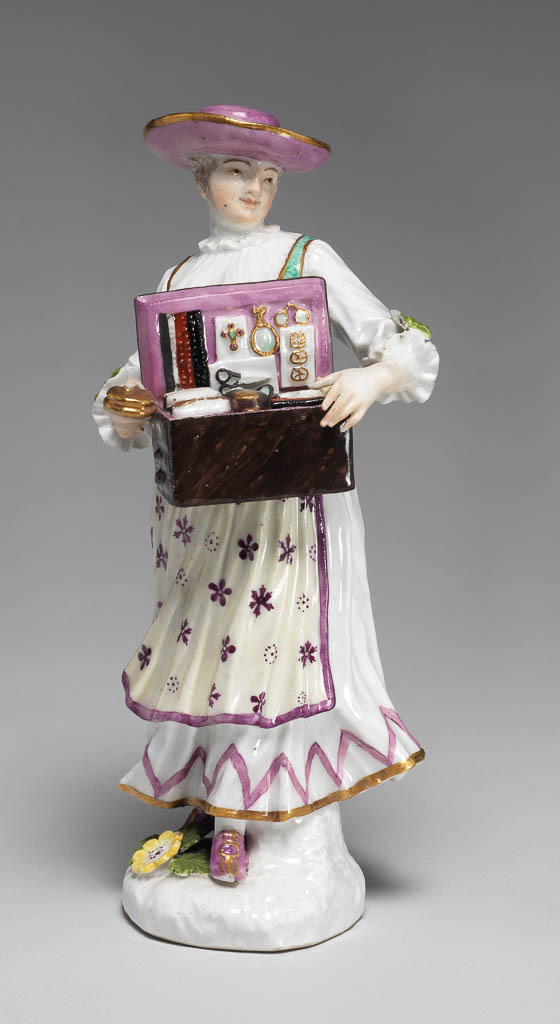 An image of Figure. A Tyrolian Woman selling Trinkets. Meissen Porcelain Manufactory, Saxony. Hard-paste porcelain painted in enamels.
