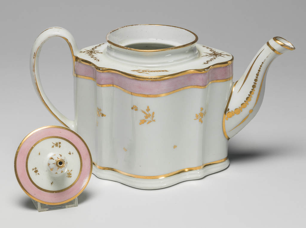 An image of Tea Pot from a Tea Service/Tea Set. New Hall Porcelain Factory, Staffordshire. Comprising a teapot and cover of 'silver' shape, a milk jug, sugar basin and cover, a slop basin, two plates of different sizes, two tea bowls, two coffee cups and two saucers. Each piece is decorated with a wide band of pink enamel between narrow gold bands and with scattered floral sprigs in gold. In addition, the milk jug has two sprays of leaves below the lip, and the teapot has sprays of leaves and formal ornament on the shoulder and further formal ornament on spout and handle. Pattern no. 223. Hybrid hard-paste porcelain, moulded, and painted lead overglaze, decorated with pink enamel and gilt, height, teapot, 14.4 cm, length, teapot, 24.1 cm, circa 1785. Rococo.