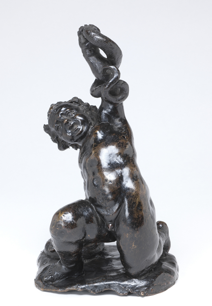 An image of Sculpture/Figure. Infant Hercules Strangling Snakes. Fanelli, Francesco, possibly (Italian, 1577-1661/64). The infant Hercules kneels on his left knee, holding one snake in his left hand above his head, whilst pinning another to the ground with his other hand. On a rough base, hole in left side of head, in the snake held in the left hand, and in the left side of his body. Copper alloy, probably brass, cast, and chased, height, whole, 20.5 cm, length, whole, 12.5 cm, after 1630-before 1700. Notes: The goddess Juno sent snakes to kill the infant Hercules, but he strangled them and survived.