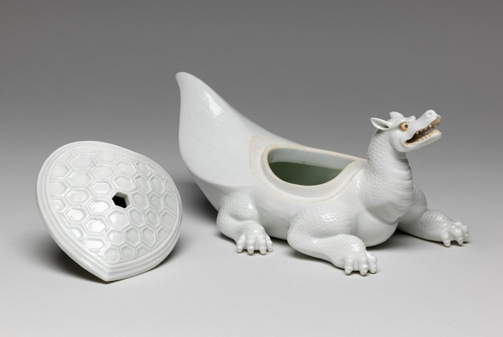 An image of Flaming tortoise, white Hirado. An immortal is missing from the lid. Unknown maker. Hard-paste porcelain, 1750-1780. Edo Period (1615-1868). Acquisition Credit: Given by David Hyatt King, through The Art Fund.
