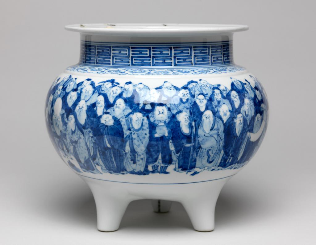 An image of Censer. Seifu (III) (Japanese). Large censer, with 100 Arhat (people who are far along the path to Enlightenment). Hard-paste porcelain, circa 1890. Meiji Period (1868-1912). Acquisition Credit: Given by David Hyatt King, through The Art Fund.