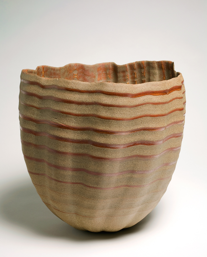 An image of Studio Ceramics. Vessel. Fisher, Daniel (British, b. 1973). Buff stoneware, thrown, hung, torn, and carved, with shino glaze ripple inside and out. Height, whole, 31.5 cm, diameter, rim, 33 cm, 2007. Gift of Nicholas and Judith Goodison through the National Art Collections Fund.
