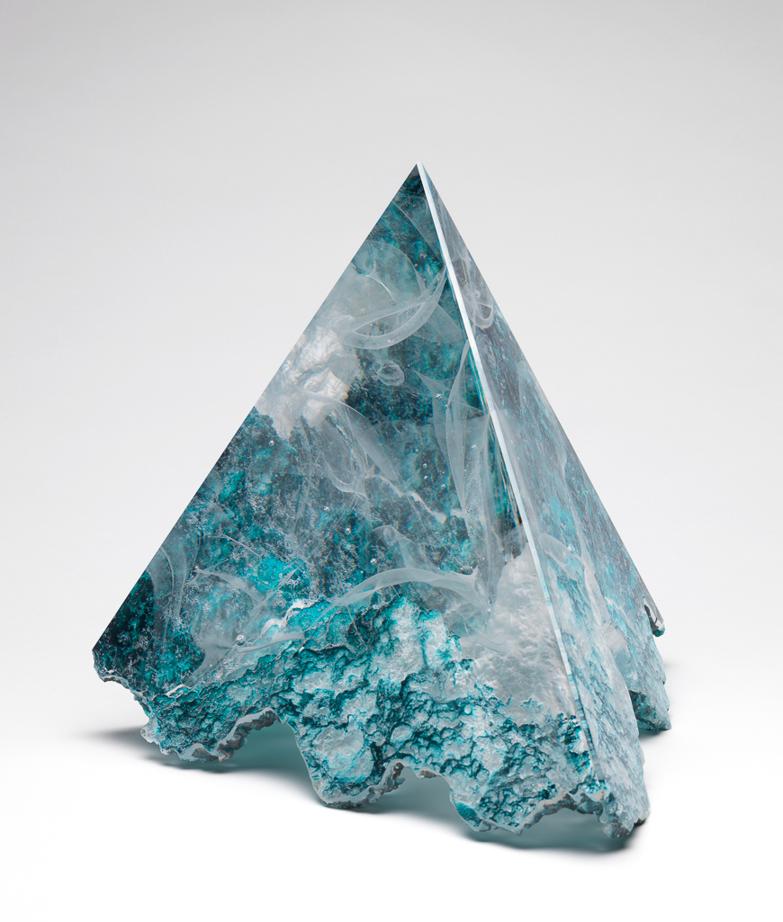 An image of Studio Glass. Pyramid Form. Reid, Colin (British, b.1953). Clear, lost-wax cast glass, with white inclusions, the base partly coloured Prussian blue. Height, whole, 20.5 cm, width, whole, 24.5 cm, 1997. Given by Nicholas and Judith Goodison through the National Art Collections Fund.