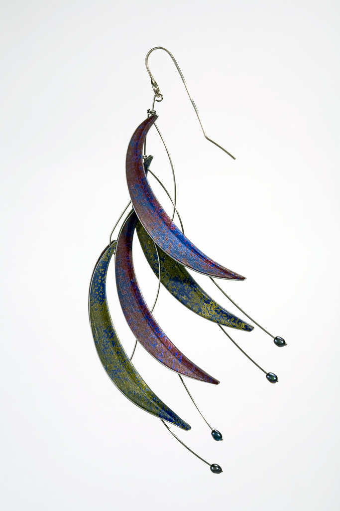 An image of Contemporary Craft/Jewellery. Pair of earings. Adam, Jane (British, b. 1954). Anodised, dyed, and crazed aluminium leaves attached to stainless steel wire, on silver hooks, height, A, 12 cm, height, B, 13 cm, 2008. Notes: See matching necklace M.7-2008. Gift of Nicholas and Judith Goodison through The Art Fund.