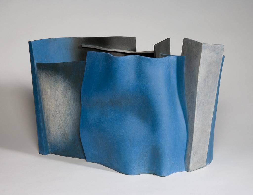 An image of Nobody's Business. Eastman, Ken (British, b.1960). Slab-built earthenware vessel with a flat base, and walls constructed of seven pieces of different sizes some curved and some angular, joined together, and coloured blue and grey, height, whole, 32.5 cm, length, bottom, 47.5 cm, length, top, 52 cm, width, base at widest, 31 cm, 2006. Gift of Nicholas and Judith Goodison through the National Art Collections Fund.
