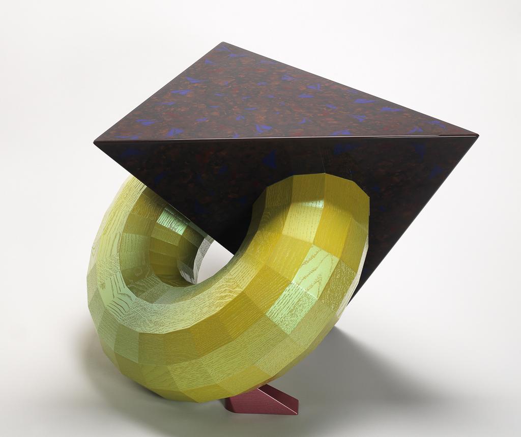 An image of Tetrahedron Toroid Table. Baier, Fred (Australian, b. 1949). Made from English oak and M.D.F. with polyester lacquer and mica enamel. Length, table top, 50 cm, width, table top, 50 cm, 1995. Acquisition Credit: Given by Sir Nicholas and Judith Goodison, through the Art Fund.