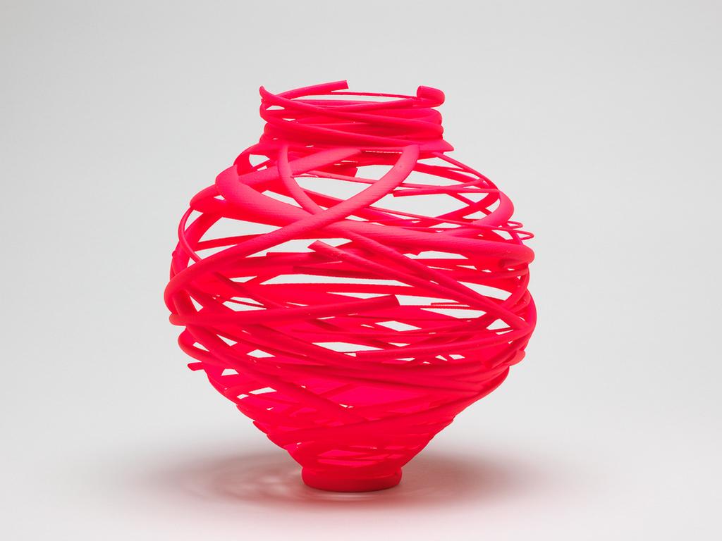 An image of Sculpture. Neon Pink Vortex. Eden, Michael (British). Sculpture made from high quality nylon material by Additive Layer Manufacturing (high quality 3D printing) with mineral soft coating no. 6. Edition 6/12. Nylon, mineral soft coating, height, whole, 24 cm, width, whole, 22 cm, diameter, whole, 16.5 cm, 2015. Acquisition Credit: Given by Sir Nicholas and Lady Judith Goodison, through the Art Fund.