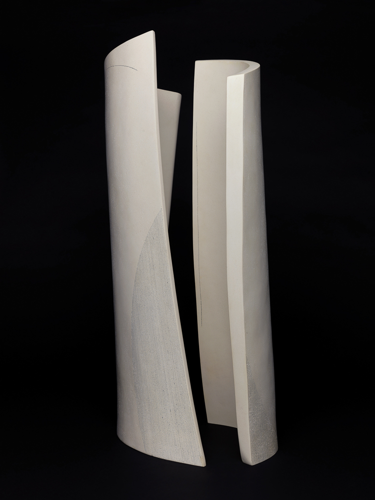 An image of Studio Ceramics. Tall Double Curves I. Priest, Frances (British, b.1976). Off-white stoneware, hand-built, polished, and incised with greyish-black narrowly-spaced striations and sweeping curved lines.  In two slightly twisted gutter-shaped parts which stand vertically adjacent to each other with the convex curves on the outside, circa 2003. Gift of Nicholas and Judith Goodison through the National Art Collections Fund.