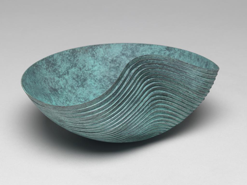 An image of Contemporary Craft/Metalwork. Pair of 'Dented Bowls'. Christensen, Ane (b. Denmark 1972). Two bowls of different sizes. Copper, pierced, and patinated green. 2003. Given by Nicholas and Judith Goodison through the National Art Collections Fund.