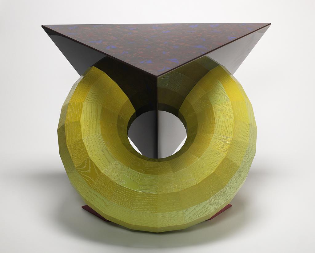 An image of Tetrahedron Toroid Table. Baier, Fred (Australian, b. 1949). Made from English oak and M.D.F. with polyester lacquer and mica enamel. Length, table top, 50 cm, width, table top, 50 cm, 1995. Acquisition Credit: Given by Sir Nicholas and Judith Goodison, through the Art Fund.