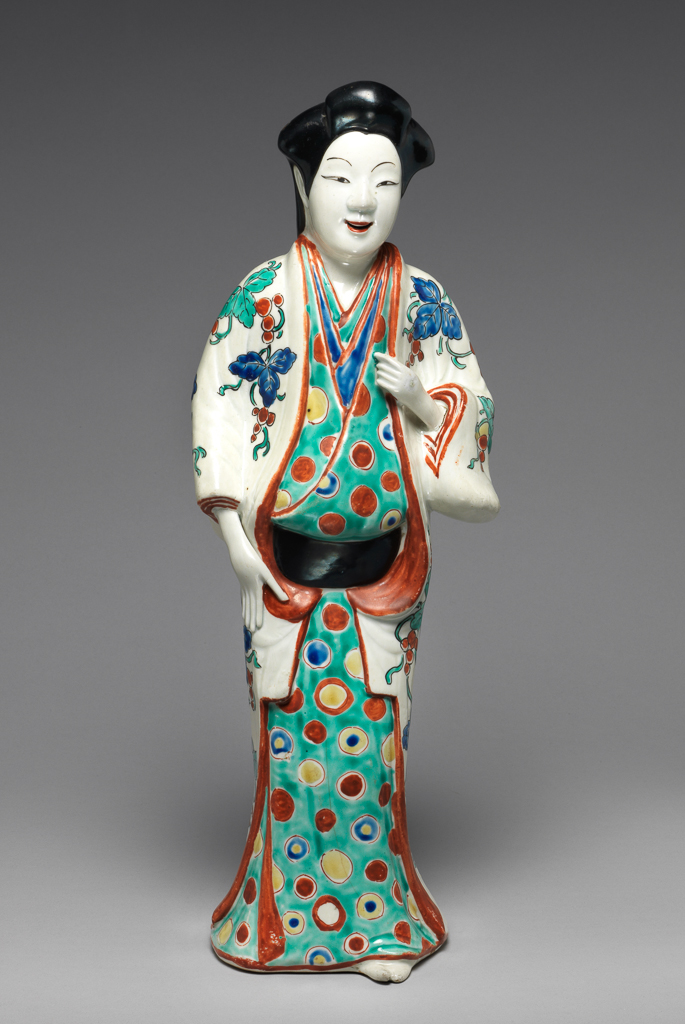 An image of Kakiemon Style. Figure of a bijin (beautiful lady). Hard-paste porcelain decorated overglaze in enamels, height 38.7 cm, circa 1680 to 1700. Arita, Japan. Edo Period (1615-1868).
