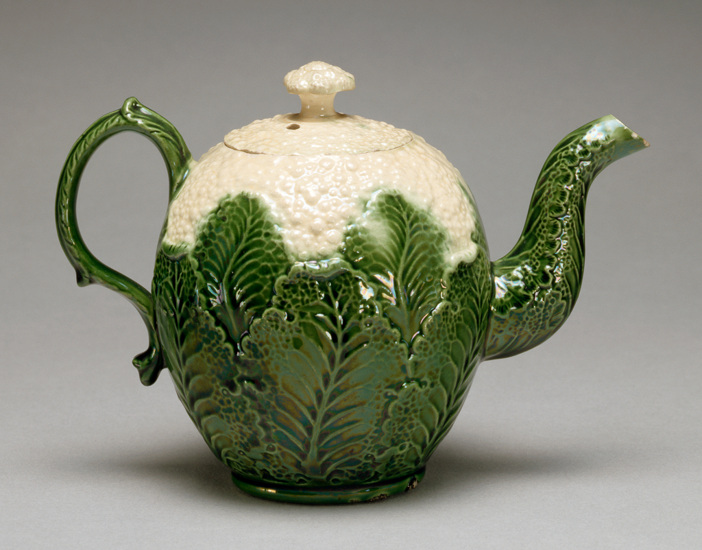 An image of Tea pot moulded to resemble a cauliflower. Wedgwood, Josiah, probably (English 1730-1795). Cream earthenware, press-moulded, slip-cast, and decorated with dark green and cream lead glazes, height 11.8 cm, width 17 cm, circa 1759-1766. Staffordshire, England.