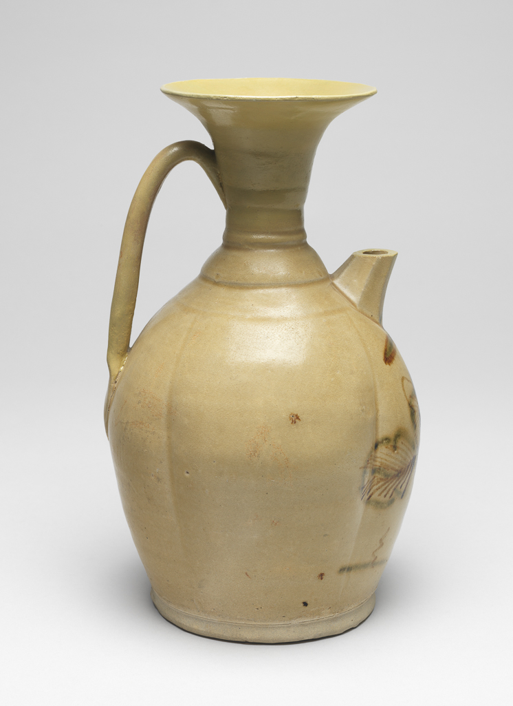An image of Greyish white stoneware ewer. Changsha Kilns. Ovoid body with an outspreading neck, a large band loop handle, and a short octagonal spout. The body is decorated with underglaze painting of flower design in brown, just beneath the spout, and covered with yellowish green glaze. 610-907. Chinese. Tang Dynasty (618-907).