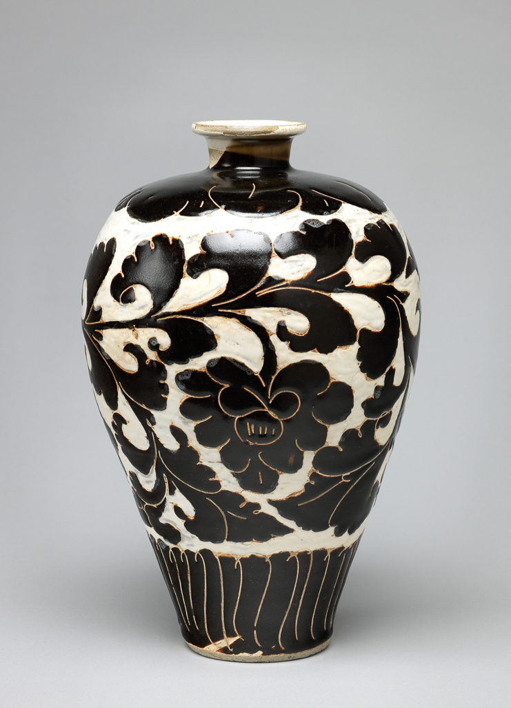 An image of Vase. Tz’u chou ware. Buff stoneware, with incised floral designs painted in dark brown. The ground has been cut away and filled in with white. Height 29.2 cm, diameter 19.1 cm, 960-1280. Song Dynasty (960-1279). Chinese.
