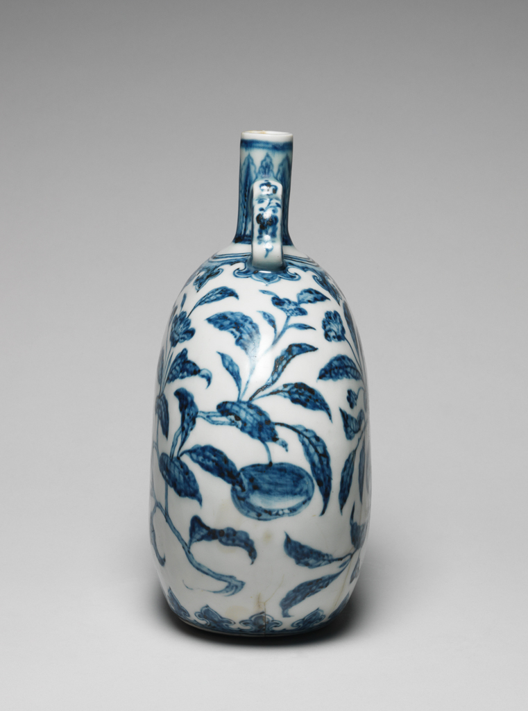 An image of Moon vase/flask. The flask is decorated in underglaze blue with fruit and flowers. Hard-paste porcelain, underglaze colours. Ming Dynasty (1368-1644). Chinese.