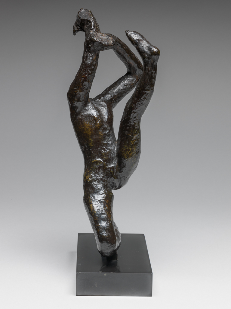 An image of Sculpture/Figure. Movement de Danse H. Rodin, Auguste (French, 1840-1917). Rudier, Georges, founder, Paris, Colmar. Bronze, cast, with rough surface, and very dark brown, shiny patination, attached by a rectangular tenon to a rectangular, straight-sided black marble base. The dancer is headless. She kneels on her right leg, leaning backwards, with her left leg stretched out upwards in front of her. Her arms are extended upwards, and in her right hand he holds an indeterminate object. Bronze, cast, with dark brown patina; on black marble base. Height, bronze, 26 cm, height, whole, 29.4 cm, height, base, 2.5 cm, length, base, 15 cm, width, base, 8 cm, circa 1950-1965. Conceived c. 1911, cast probably 1950s when Roland Browse & Delbanco included several of the dancers in their exhibitions, or between 1963-65.