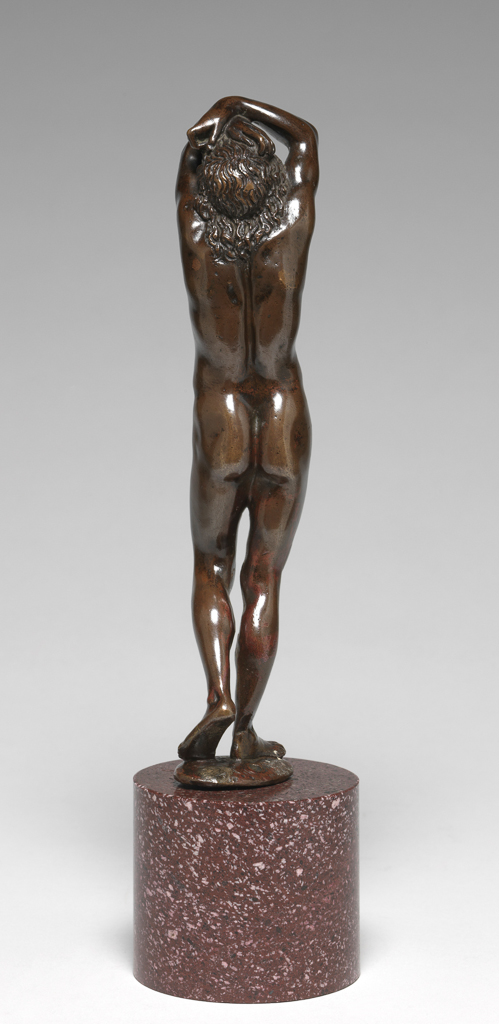 An image of Sculpture / Figure. Standing Youth, known as Narcissus. Prieur, Barthélemy (French, School of, 1536-1611). Copper alloy, probably bronze, cast, patinated, and polished, mounted on a red porphyry pedestal, height, whole, 20.8 cm, circa 1600-1650. Renaissance.