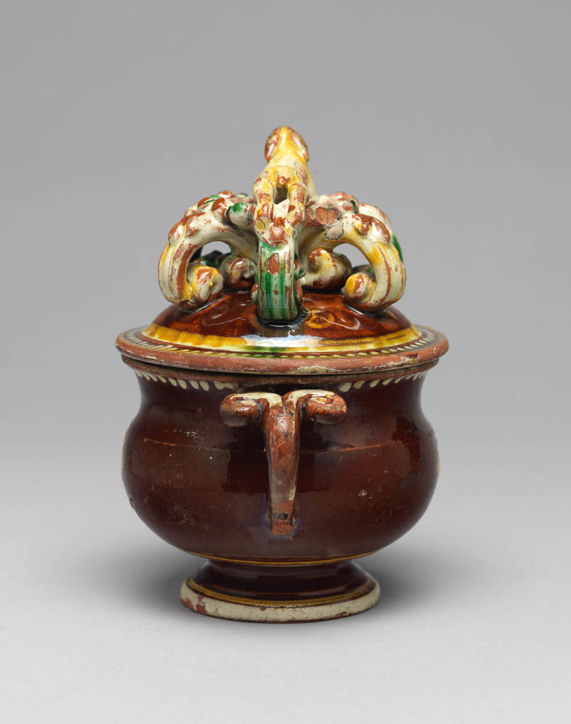 An image of Sugar bowl and cover. Production place: Langnau, Switzerland. Earthenware, decorated with slip, and lead-glazed, circa 1780-1800.