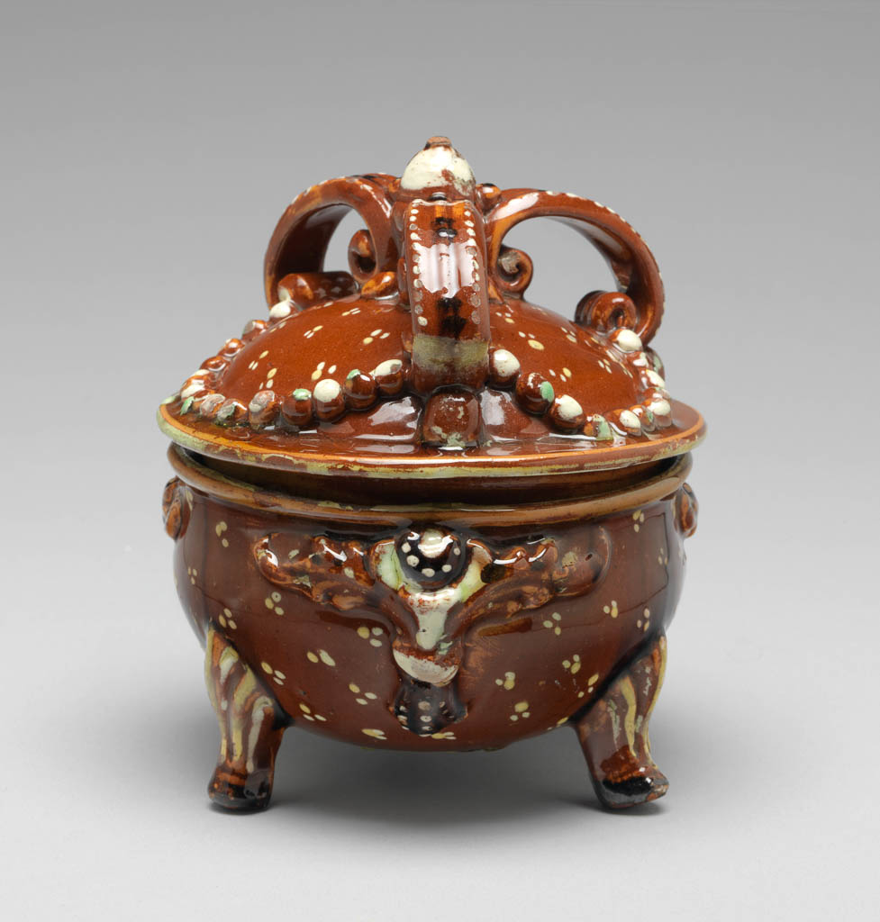 An image of Sugar bowl and cover. Production place: Langnau, Switzerland. Earthenware, decorated with slip, and lead-glazed.