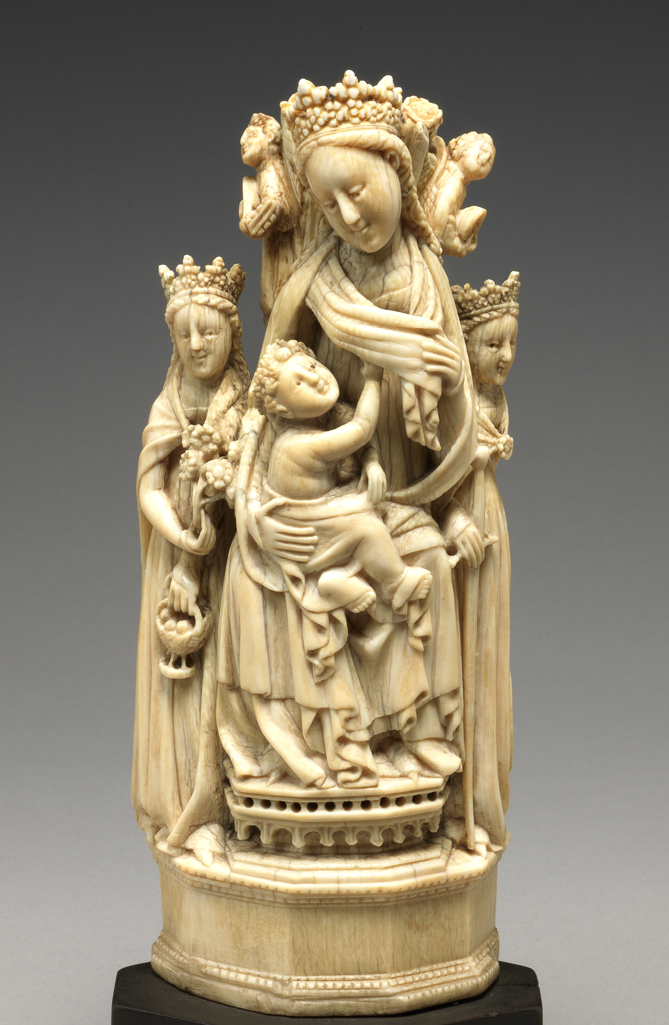 An image of Sculpture / Figure Group. The Virgin and Child with St Dorothy and St Catherine. Virgin and Child seated on a throne with high back, on the top of which stand four small music-making angels. On the left, St Dorothy holding a basket of roses, and on the right, St Catherine with wheel and sword. Carved ivory in the round, height, ivory, 18.9 cm, height, ivory and base, 22.5 cm, circa 1470-1530. German or Spanish.