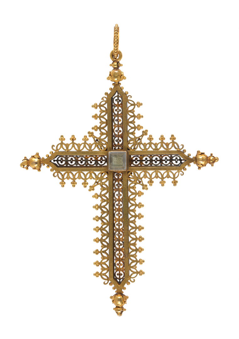 An image of Jewellery. Pendant, cross. Rinzi, Ernesto (British, 1836-1909, London). In the middle of the back, an empty square compartment under glass. At the top, a ring loop and a beaded ring for suspension. In original leather case (A). Gold openwork set with cabochon sapphires and four pearls, height, whole, 10.0 cm, width, whole, 7.5 cm, circa 1860-1865. Acquisition Credit: Given by Mrs J. Hull Grundy.