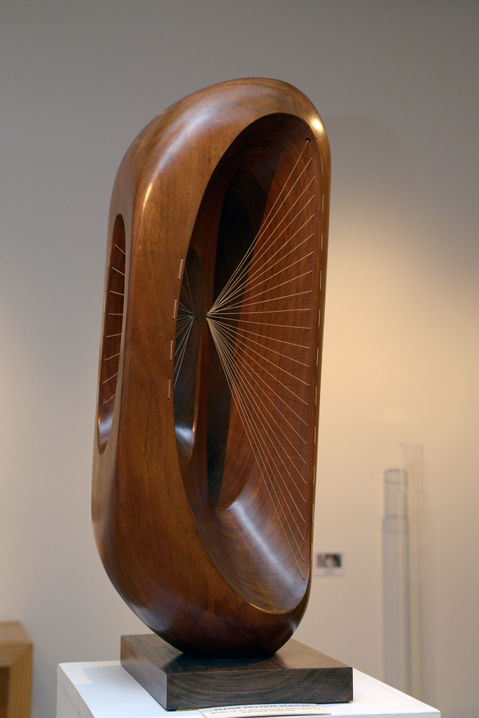 An image of Fugue. Hepworth, Barbara (British, 1903-1975). Mahogany and string, height (whole) 78.0cm, base 34.5 cm, base 23.0 cm, 1956. Notes: Installation views of Gallery 20. April 2013.