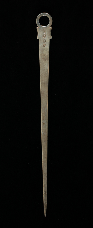 An image of Meat skewer. A simple ring terminal with flared shoulders above the flat, tapering blade. Pittar, John, silversmith, Dublin. Silver, length, overall, 31.9 cm, weight, overall, 68 g, 1789- 1790.