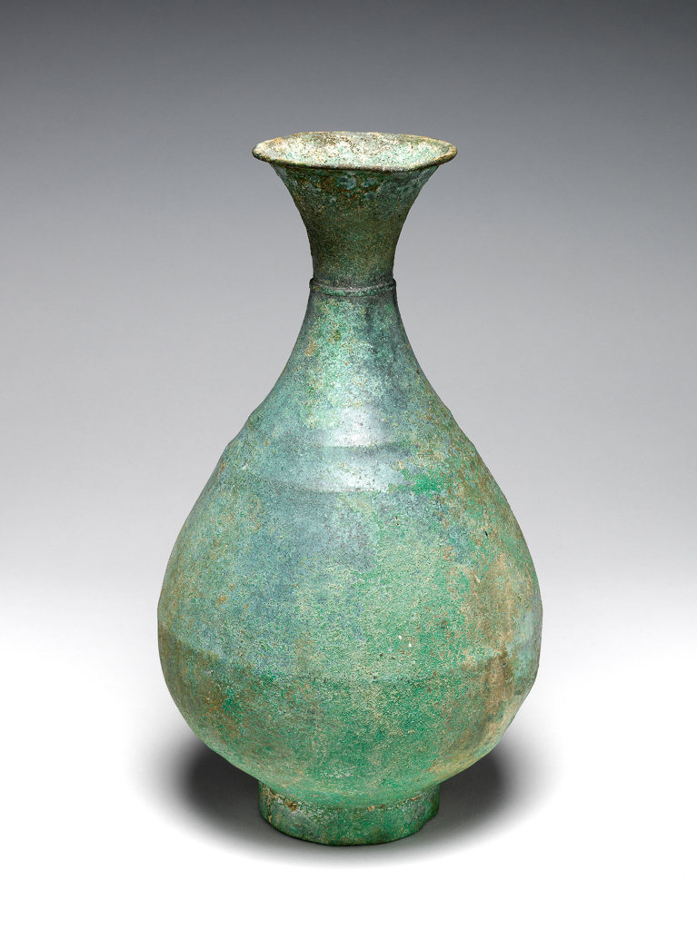 An image of Vessel. A pear-shaped vase with elegant flaring mouth, a slight ridge-collar at narrowest part on cylinder. Foot rim of bronze, green patinated over silvery surface. Circa 935-1392. Korean.
