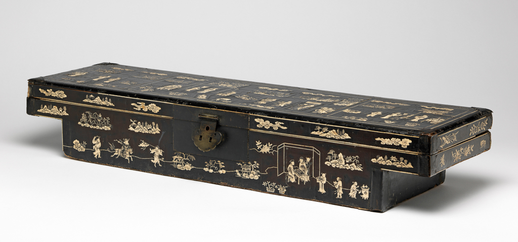 An image of Document box. Lacquer document box, with bone inlay. It is possible that this type of document box was designed to fit between the parallel carrying poles of a sedan chair. Length 76.4 cm, 1600-1699. Chinese.