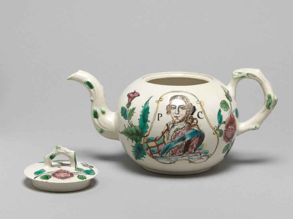 An image of Commemorative Ware/ Crabstock teapot. Unidentified Staffordshire Pottery. White stoneware, painted in enamels with a bust portrait of Prince Charles Edward Stuart, initials P C, thistles and roses. Thrown, moulded, salt-glazed, painted, circa 1755-1765. Rococo. Georgian. English.