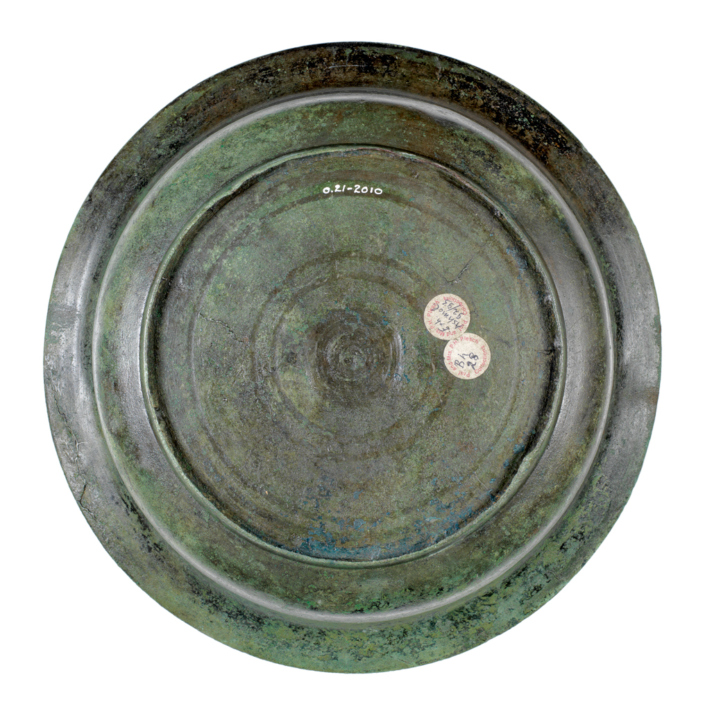 An image of Metalwork/Basin. Unknown Maker. Deep basin with elegantly curved sides and averted rim on shallow foot-ring, of spun bronze, heavily patinated, azurite outside base. AD 1000-1200. Production Place: Korea.