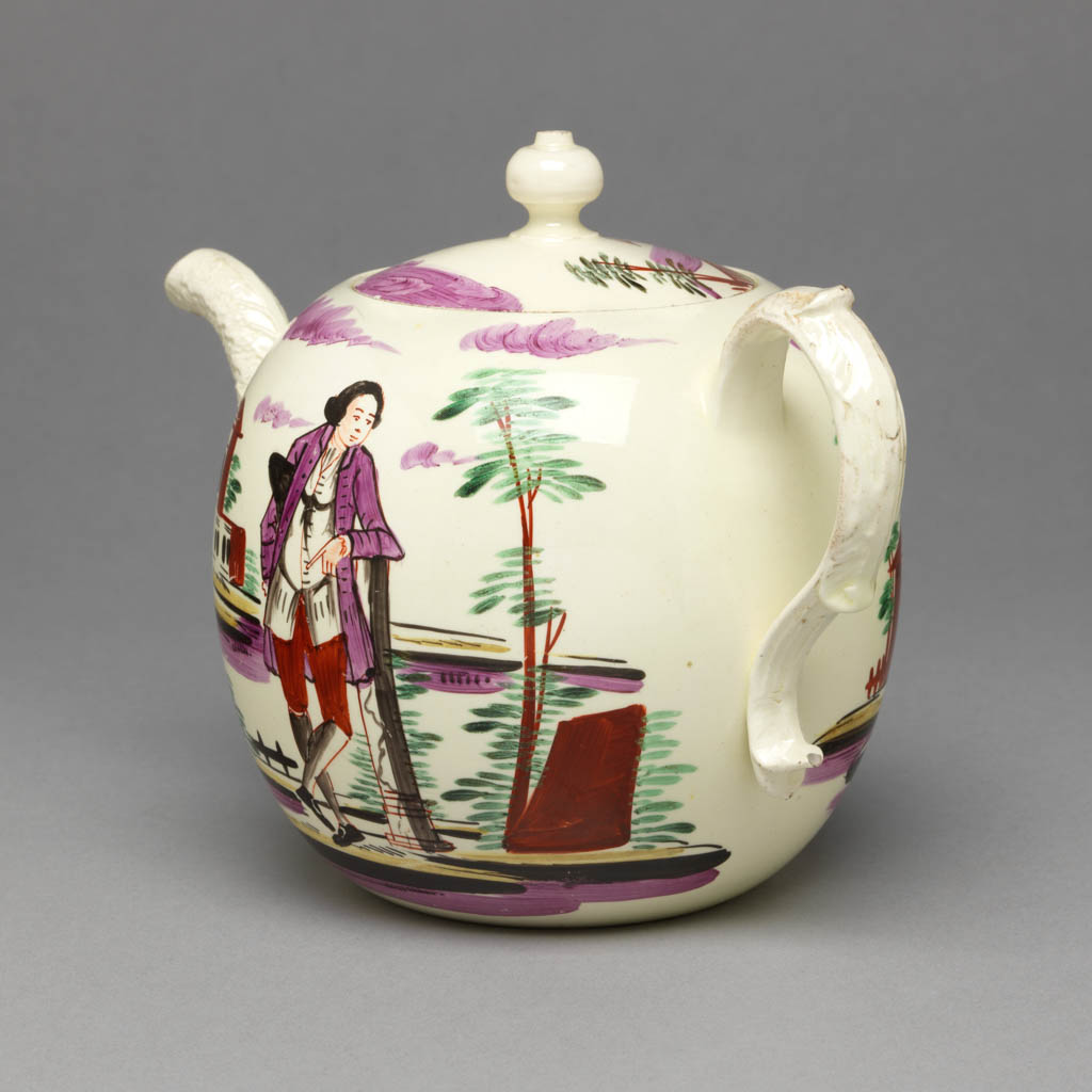 An image of Teaware. Teapot and cover. Wedgwood, Josiah (British, 1730-1795). Production: England, Staffordshire, Burslem. The pot has a globular body with moulded overlapping leaf spout and reeded and leaf-moulded handle. The circular, slightly domed cover has a pierced globular knob. One side of the pot is decorated with a gentleman leaning on a post in a landscape with a building on the left; on the other side with two buildings in a landscape; and on the cover with one building between trees. Cream-coloured earthenware, lead-glazed, painted in green, yellow, pale purple, reddish-brown, and black enamels. Height, whole, 13.6 cm, length, whole, 19.6 cm, circa 1770-1775. Rococo.  Production Note: Probably enamelled in London. The decoration is in the style associated with David Rhodes. Acquisition Credit: Given by Sir Ivor and Lady Batchelor.
