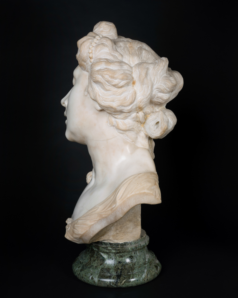 An image of Sculpture/bust. Bust of Cleopatra. Parodi, Giacomo Filippo (Italian, 1630-1702). Creamy-white marble, carved in the round, supported on a circular verde antico socle, height, bust, 78.75 cm, height, socle, 12 cm, circa 1680-1690. Baroque. Production Note: The bust was attributed to Giambologna when published in 1909 (see Documentation). It was probably made during one of Parodi's sojourns in the Veneto, Venice or Padua during the 1680s.