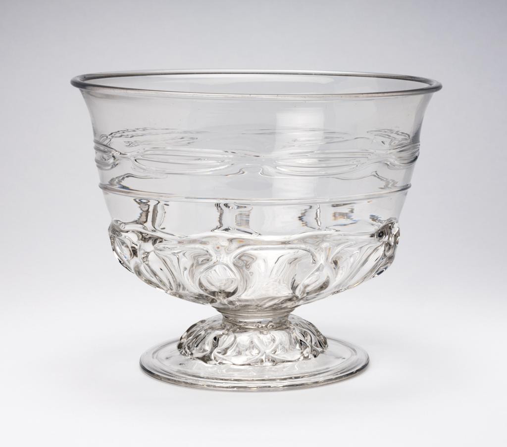 An image of Punch Bowl. Unidentified English glasshouse. Blown lead-glass, with diamond-pincered moulded ribbing on the lower part and a horizontal band of trailed threading above. 1695-1700. Baroque. Sir Ivor and Lady Batchelor Bequest through The Art Fund.