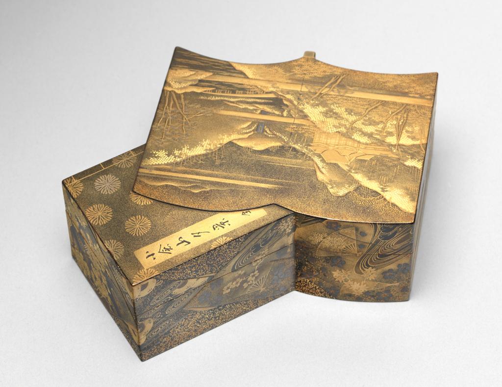 An image of Box, lid and tray. Unknown maker, Japan. Box in the shape of two intersecting books, one open and one closed with a seated lid (A) and containing a tray (B). The open book is decorated in gold and silver-grey hiramakie (low-relief sprinkled design) and takamakie (high-relief sprinkled design) and togidashi (brought out by polishing) with a mountainous landscape, trees, a waterfall, a bridge spanning a river and a pavilion on a black and gold powdered ground. The closed book is decorated in togidashi with gold flower heads on a black and gold powdered ground, with gold bindings and the title in a gold rectangular panel. The title reads `A View of Konensan `, the last character meaning 'complete in one volume.' The sides are finely decorated with intricate brocades of flower heads, leaves, ducks, fans and diaper patterns in gold, red and silver-grey on a black nashiji (shimmering spangles) ground. The tray is finely decorated in gold, red and silver-grey with sprays of autumn flowers and foliage on a black and gold powdered ground with a gold rim. The base of the tray is nashiji.The inside and the base are nashiji. Lacquer, decorated in hiramakie (low-relief sprinkled design), takamakie (high-relief sprinkled design), togidashi (brought out by polishing) and nashiji, height, whole, 4.0 cm, width, whole, 11.0 cm, length, whole, 11.8 cm, circa 1700-1868. Edo (1615-1868). Acquisition: