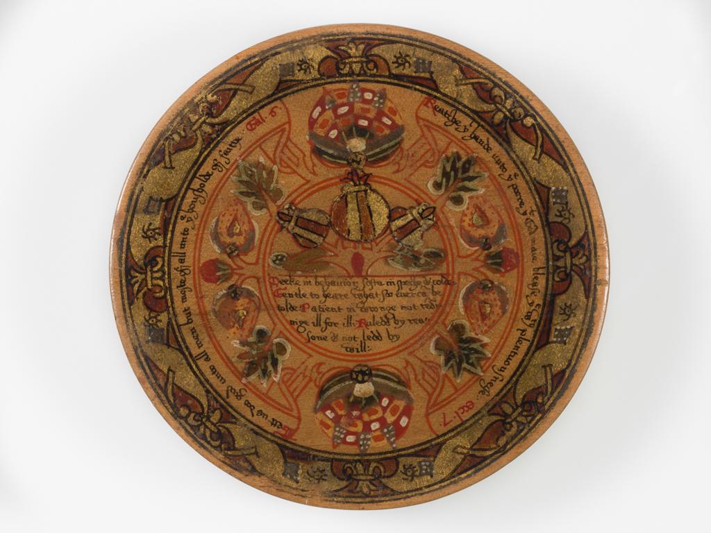 An image of Woodwork. Box of roundells. Box containing twelve trenchers. Wood, painted, gold decoration, height, box, 3.2 cm, diameter, box, 16.6 cm, diameter, roundels, 13.2 cm, circa 1600. Renaissance. Elizabeth I. English.