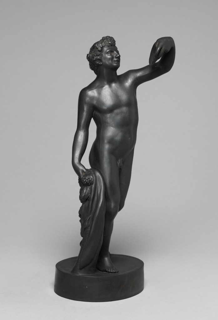 An image of Stoneware Figure. Bacchus. Wedgwood. After the marble made by Jacopo Sansovino (1486-1570) for Giovanni Gaddi in 1511-12, and now in the Museo Nazionale, Florence. Production Place: England, Staffordshire. Black basalt, moulded, height, whole, 27.7 cm, after 1780 to before 1860.
