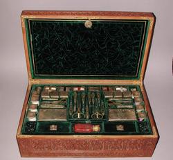 An image of Needlework tools in a workbox