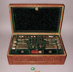 An image of Needlework tools in a workbox