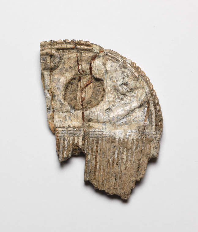 An image of Cosmetic equipment/Comb, carved with Sphinxes and Lions. Height 0.044 m, width 0.03 m, circa 650-630 B.C. Find Spot: Temple of Artemis Orthia, Sparta, Greece.