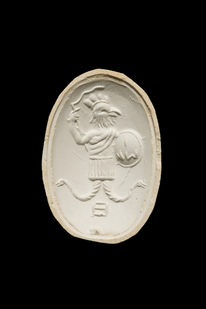 An image of Engraved gems. Magical amulet. Obverse: Cock-headed anguipede. Reverse: Inscription. Intaglio cutting, chalcedony, AD. Roman.