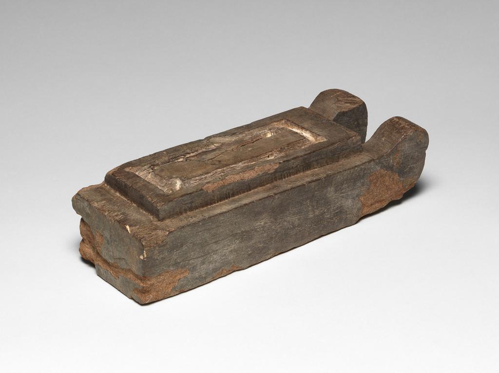 An image of Statuette. Model sledge for statuette. Production Place: Egypt. Find Spot: Saqqara, Egypt; H5-528. Wood, height 0.0625 m, length 0.2275 m, width 0.086 m, 700-101 B.C. Late Period. Persian. Ptolemaic.