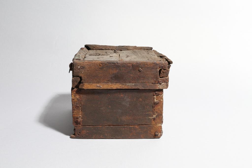 An image of Cosmetic equipment? Casket, with four compartments. Wood, bronze lock plate, height 0.11 m, length 0.13 m, width 0.13 m. Production Place: Egypt. Coptic Period.