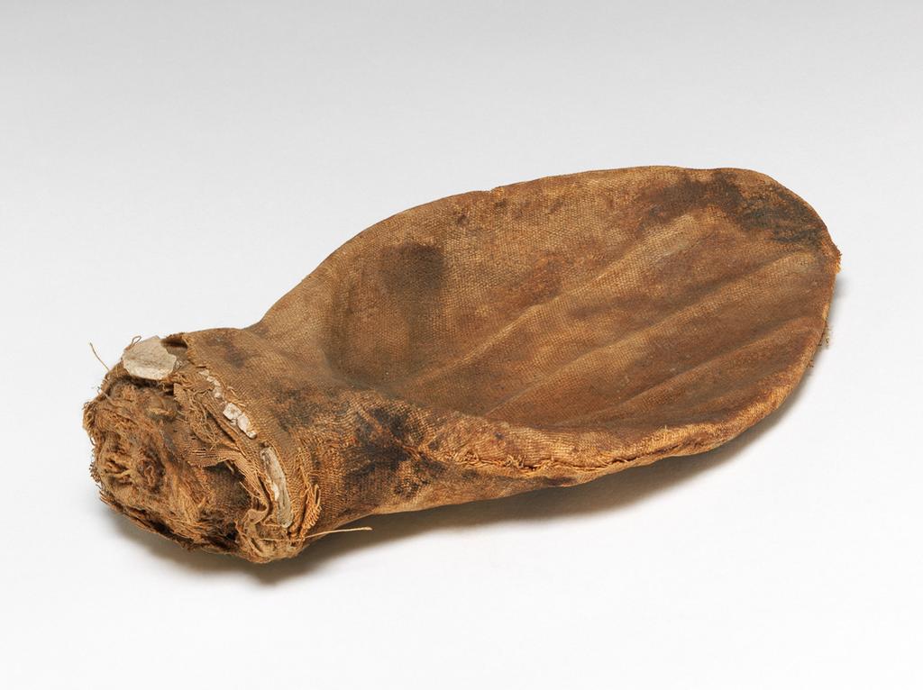 An image of Mummified ear of a cow or bull. Find Spot: Egypt. height 0.185m.