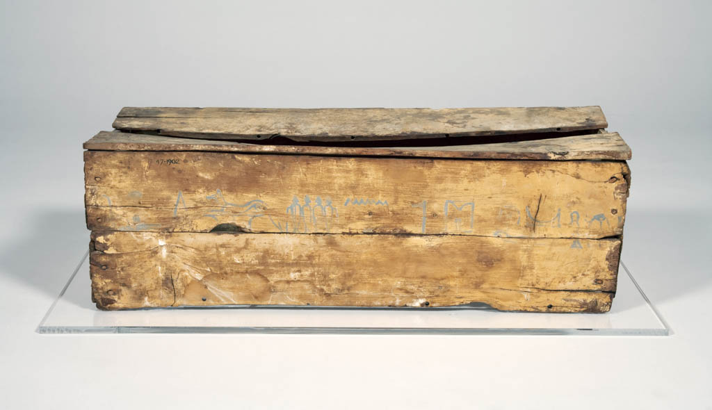 An image of Funerary equipment. Coffin. This dog was given his own tomb and is named in the coffin text five times. His names was 'Heb'. Production Place: Egypt. Find Spot: Beni Hasan. Wood, height 21 cm, length 70 cm, width 27 cm. Eleventh Dynasty; Twelfth Dynasty; Middle Kingdom, 2119-1794 B.C.