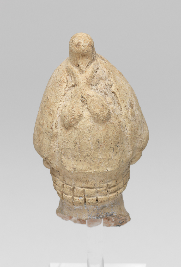 An image of Figure/Head. Male head, wearing cap. Production Place: Cyprus. Find Spot: Salamis, Cyprus. Clay, moulded, height 0.063 m, width 0.033 m, 600-501 B.C. Archaic Period.