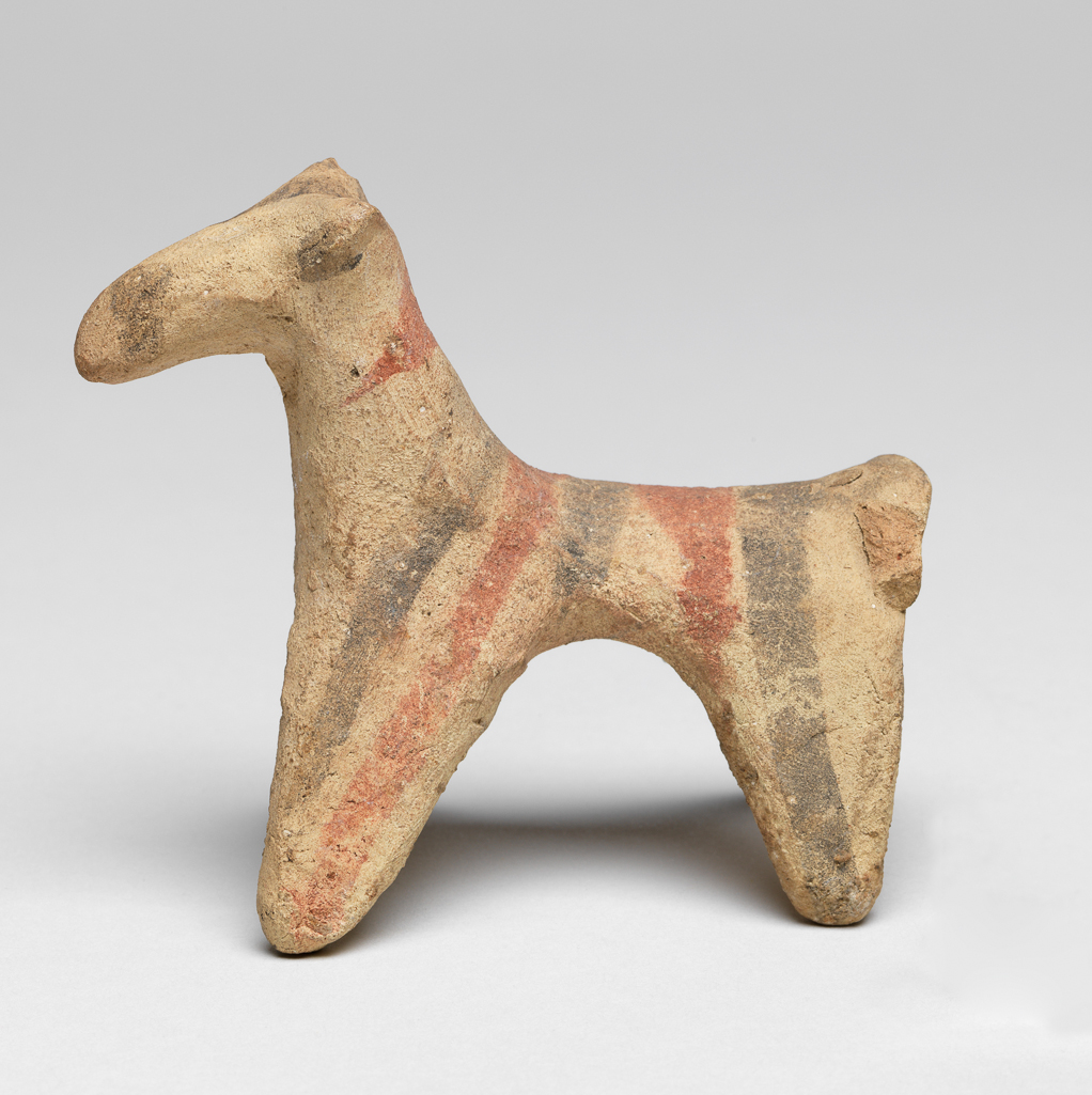 An image of Figurine. Dog. Production Place: Cyprus. Find Spot: Salamis, Cyprus. Clay, handmade, height 0.08 m, width 0.048 m, 600- 501 B.C. Archaic Period.